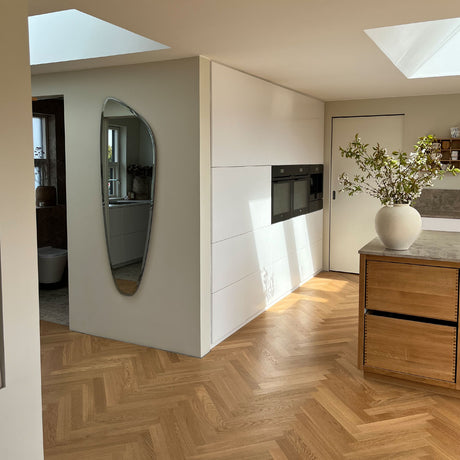 Asymmetrisk spejl med facetkant